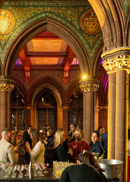 People during an event in a beautiful room