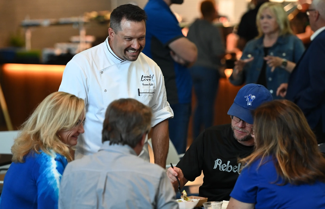 Chef Carmen talking with customers