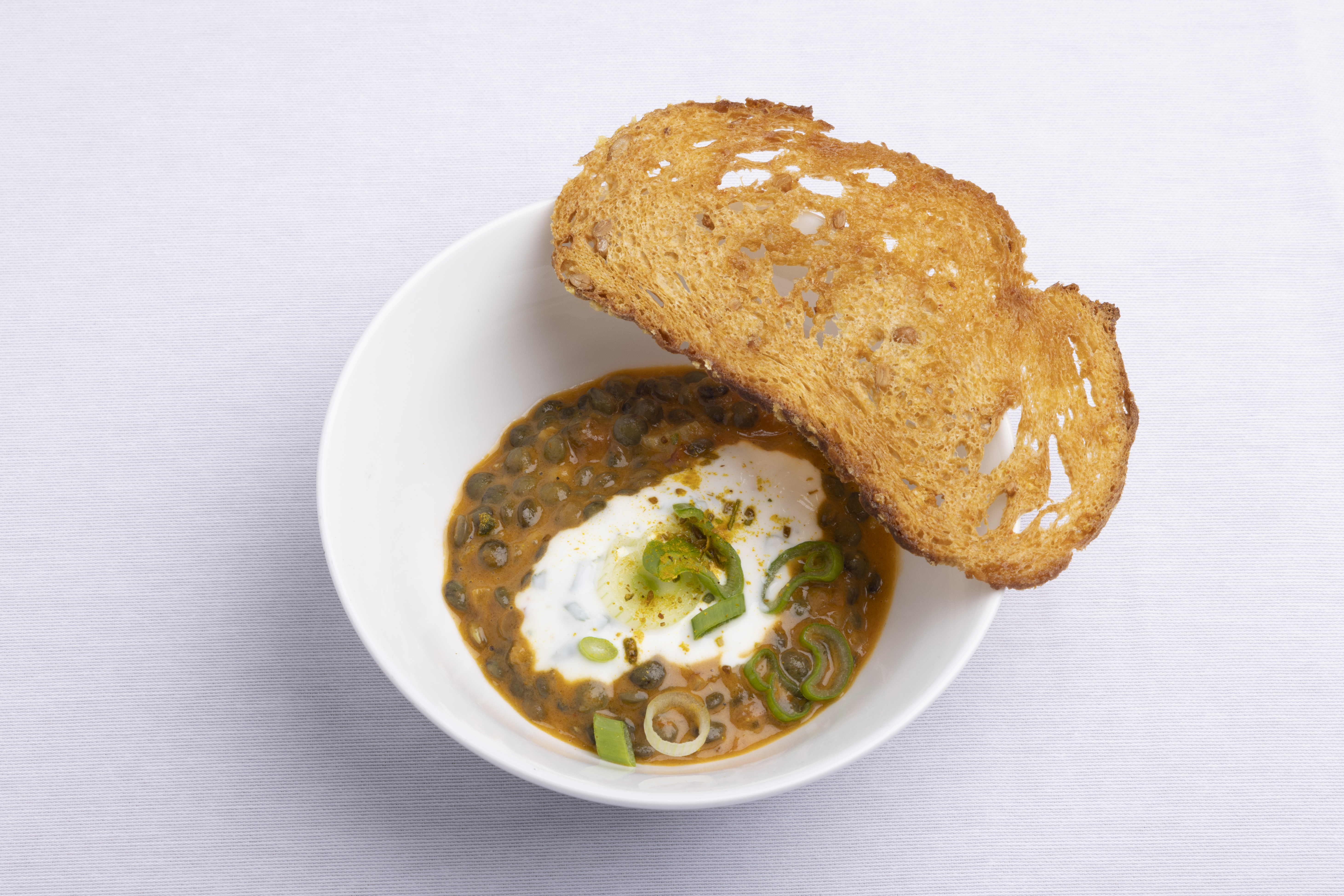 Green Lentil Dahl with Skyr, Cilantro, and Corn Tuile