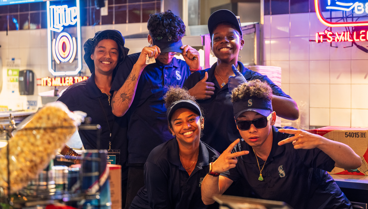 Group of employees at concessions smiling