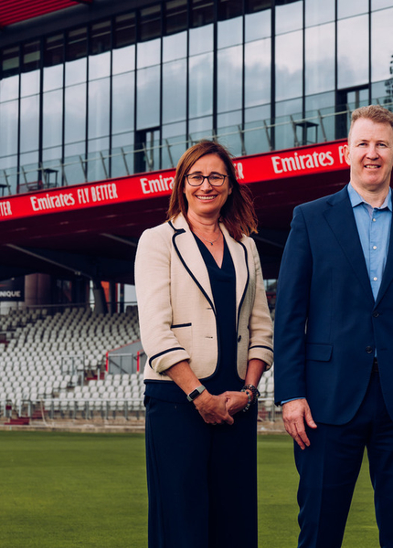 Claire Morris, Daniel Gidney and Andrew Hare on the stadium lawn
