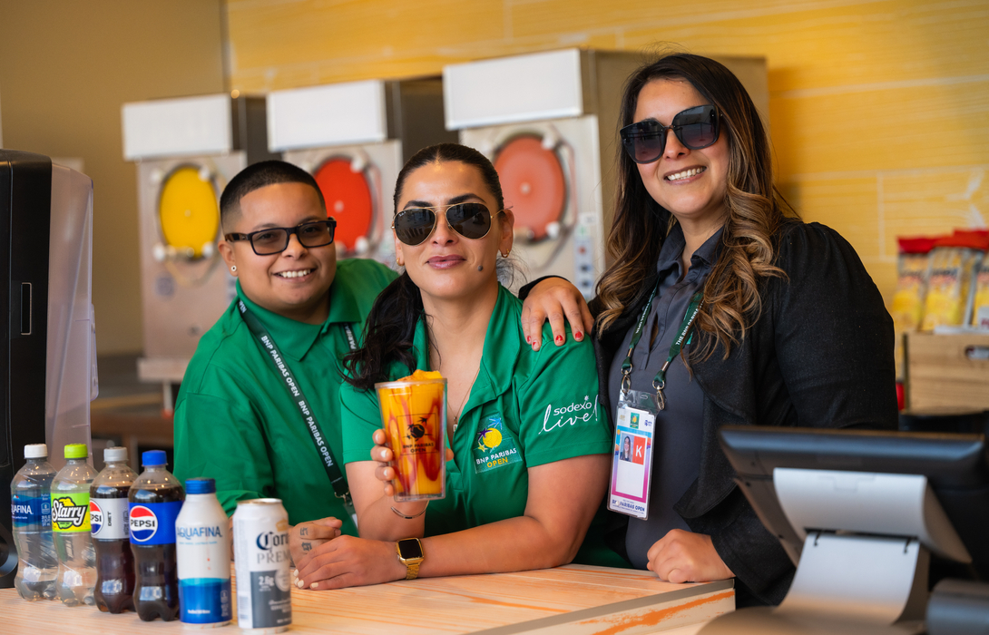 team members serving drinks