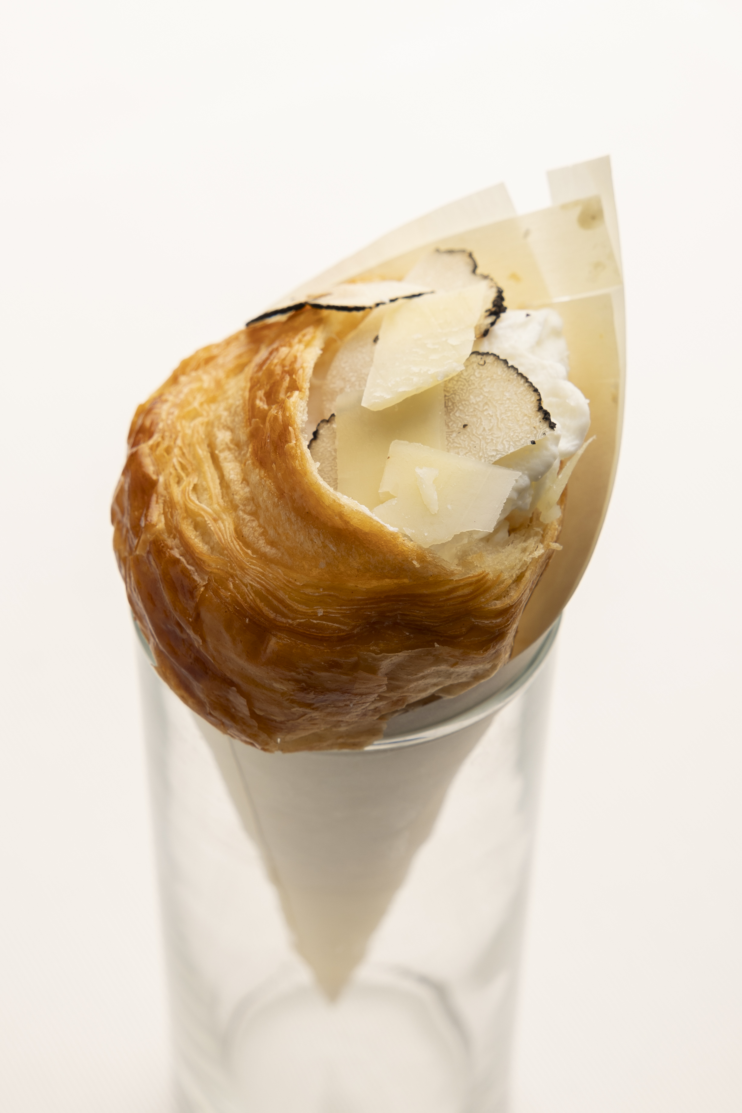 Poached egg croissant, artichoke cream, shaved tomme cheese, sheep's cheese, truffle