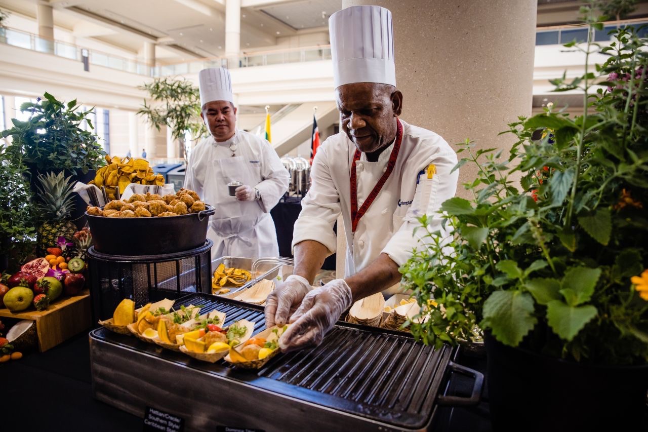 chefs serving food 