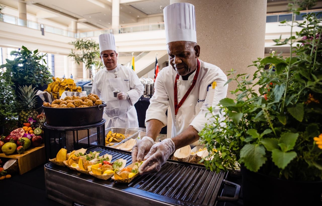 chefs serving food 