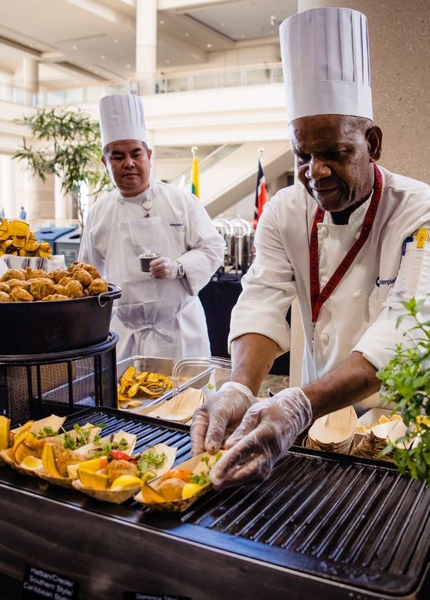 chefs serving food 