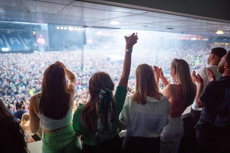 Guests overlooking stage at concert at Hampden Park