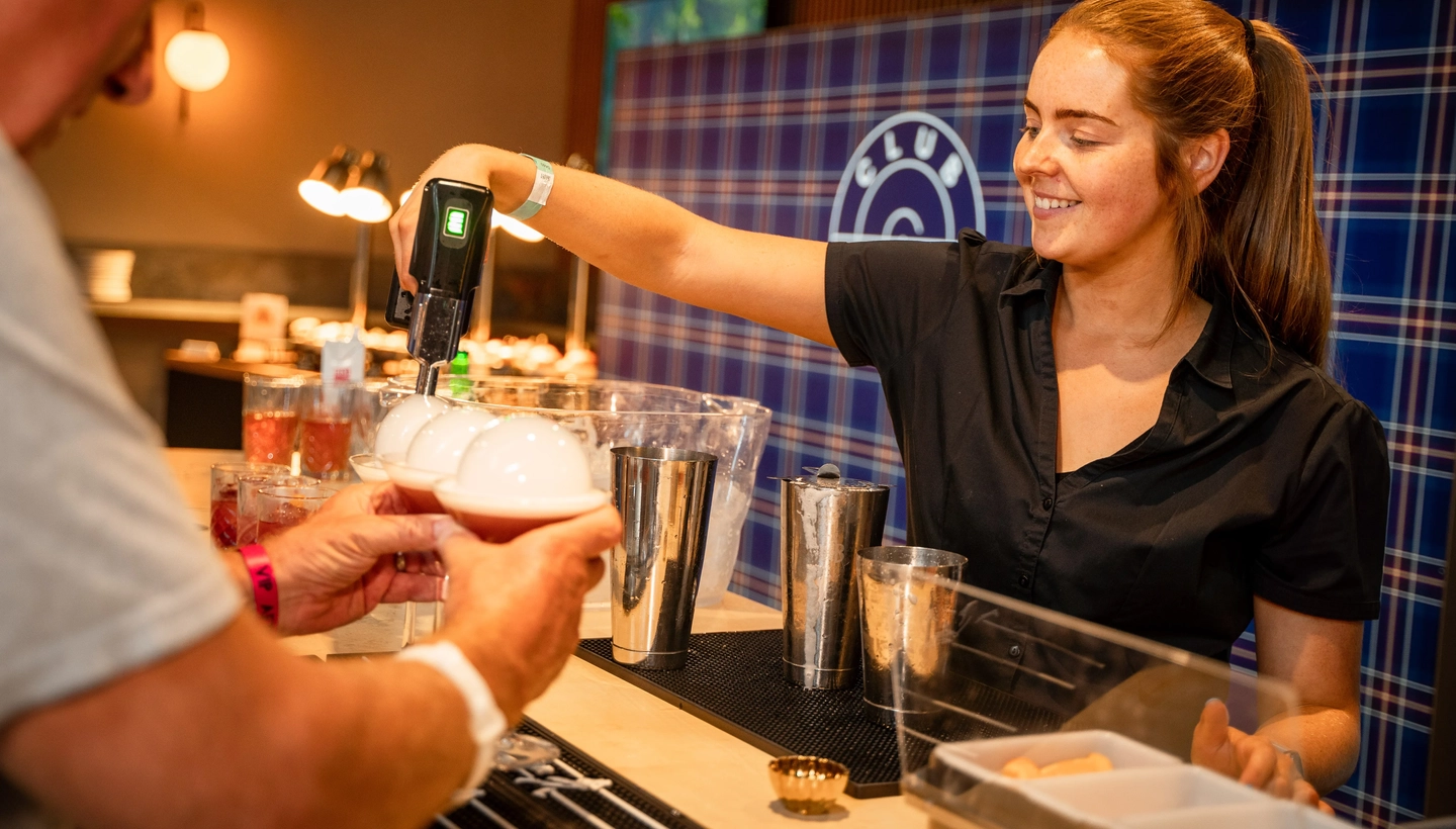 Waitress serving glasses at Hampden Park